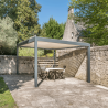 Vue de loin Pergola Bioclimatique manuelle avec store ESSENTIEL sur une terrasse